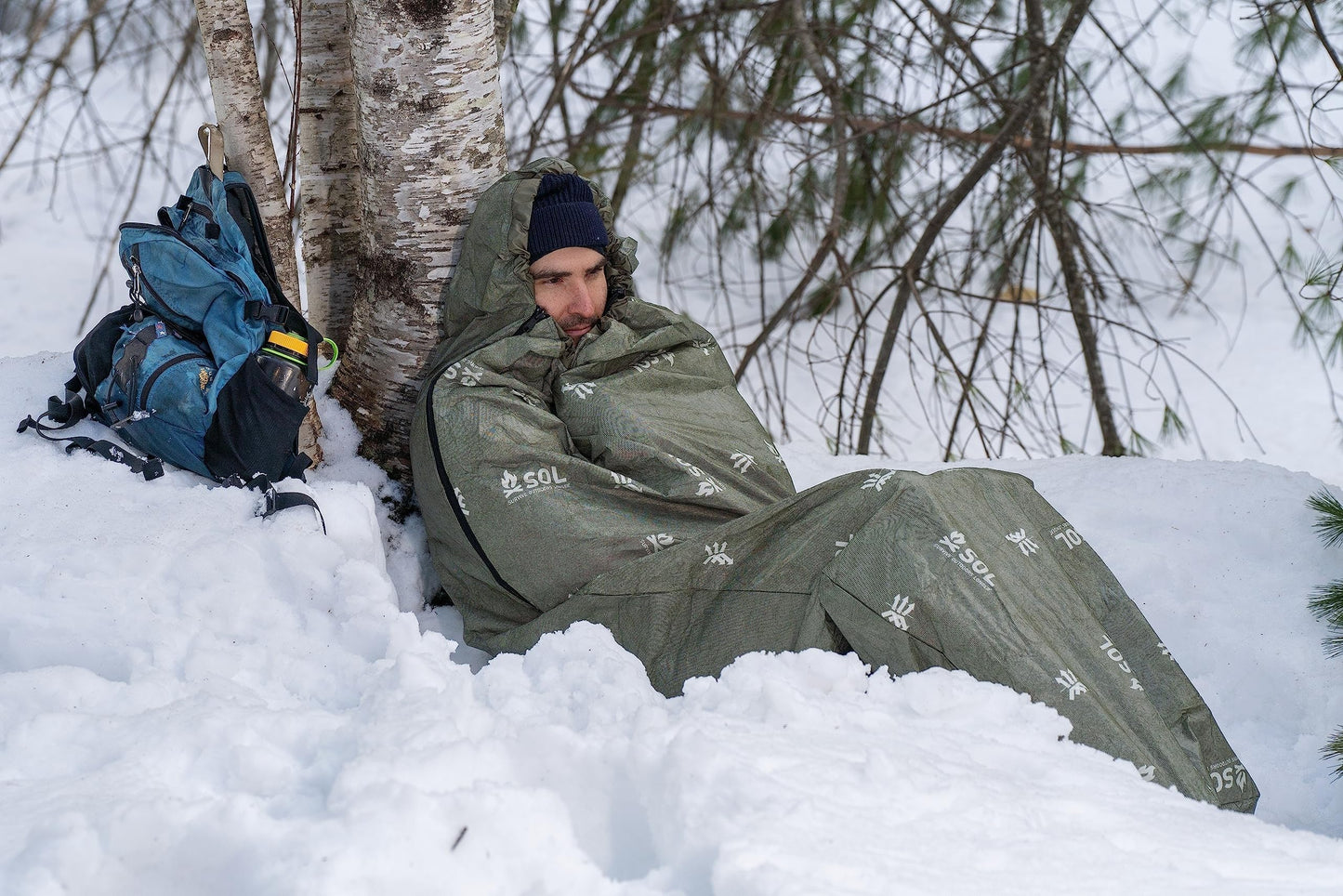 SOL Escape Bivvy with Hood - Emergency Preparedness Blanket - Reflects Up to 70% Body Heat - Outdoor Survival Bivvy - Water Resistant - Durable & Breathable - Winter Camping Supplies - Green