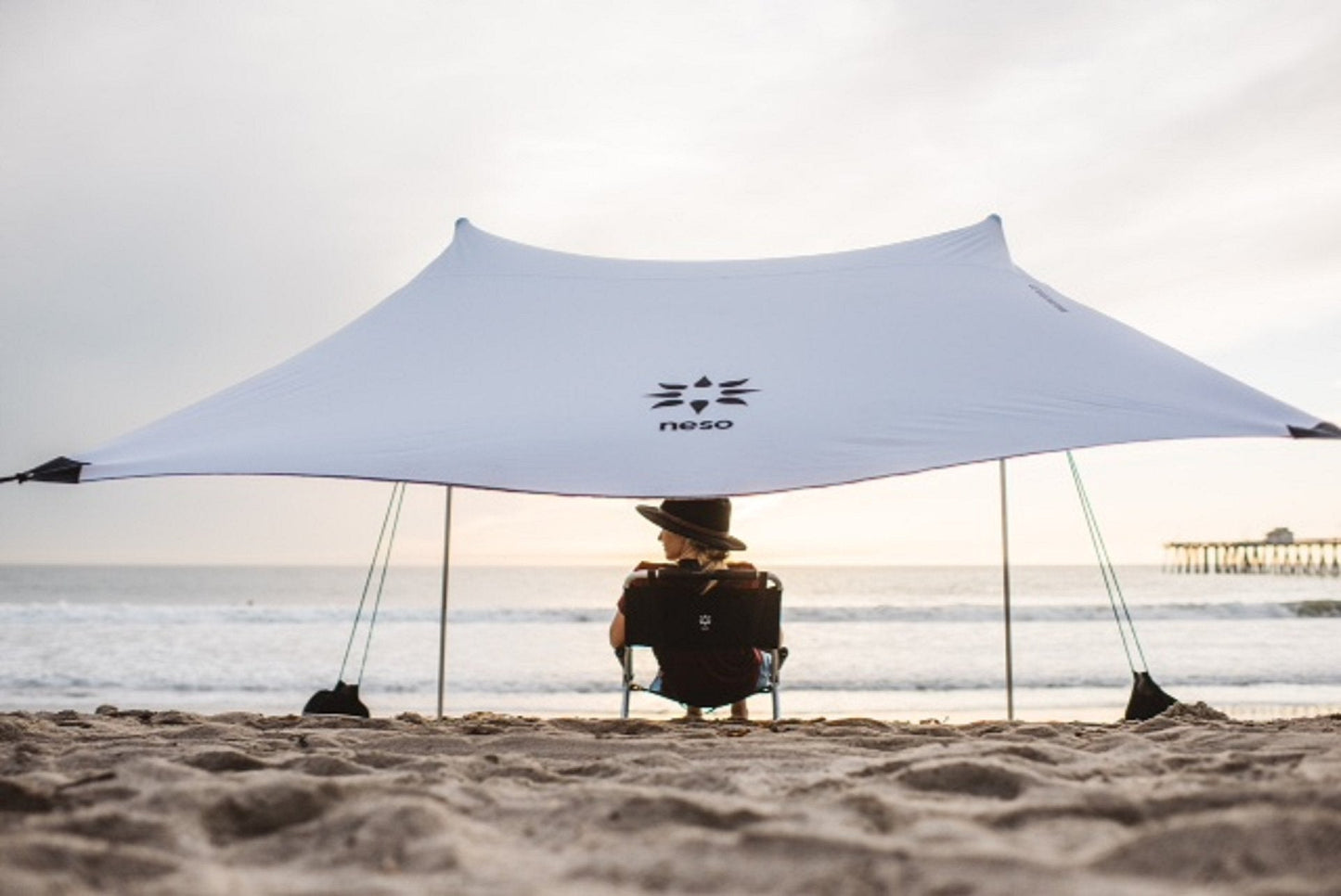 Neso Portable Beach Tent Sun Shelter with Sand Anchor - Lightweight Beach Shade Canopy - Easy Setup for Family Outings - Patented Reinforced Corners - UPF 50+ Sun Protection - 7 x 7ft - White