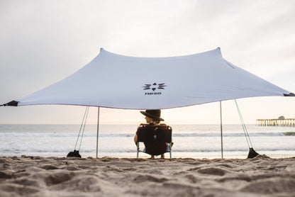 Neso Portable Beach Tent Sun Shelter with Sand Anchor - Lightweight Beach Shade Canopy - Easy Setup for Family Outings - Patented Reinforced Corners - UPF 50+ Sun Protection - 7 x 7ft - White