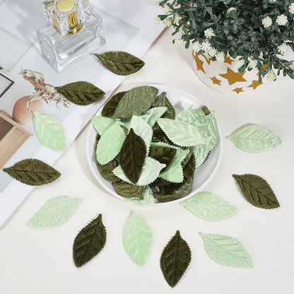 CABODYALS 100Pcs Mixed Green Velvet Fabric Leaves Spring Faux Artificial Craft Small Leaf Double Face Decorative Cloth Appliques Bulk for Sewing Making Wedding Party Scrapbooking Decor DIY Supply