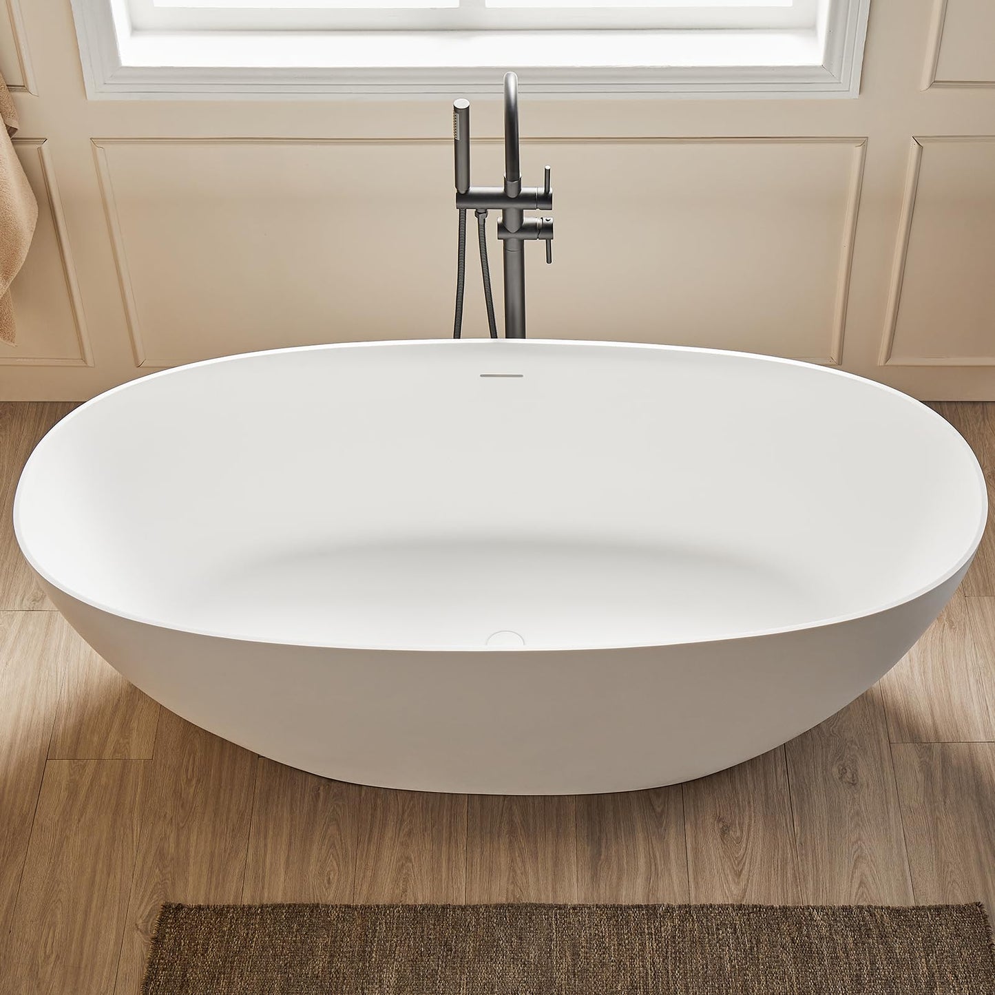 Cpingao 63" Solid Surface Freestanding Bathtub, Modern Oval Shape Soaking Tub, Stone Resin Stand Alone Bathtub with Drain & Integrated Slotted Overflow Matte White 8845-1600