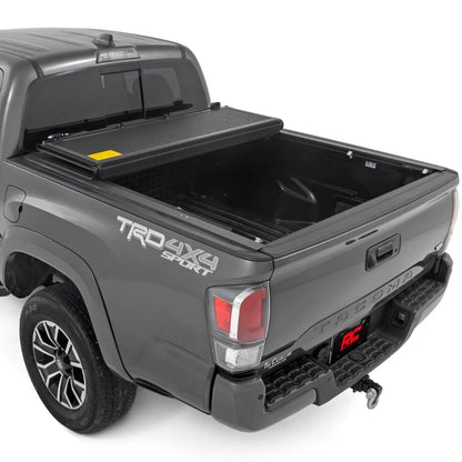 Rough Country Hard Low-Profile Tri-Fold Tonneau Cover for Toyota Tacoma (2016–2023) - Low-Profile Aluminum Truck Bed Cover, Fits 6' Bed (72.5")