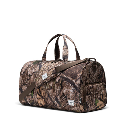 Herschel Supply Co. Unisex Novel Duffle, Realtree APX Camo (Limited Edition), Special Edition - 43L