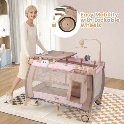 Costzon 3 in 1 Pink Pack and Play with Bassinet, Portable Baby Playard with Changing Table, Music Box, Hangings, Wheels/Brake, Basket, Foldable Infant Pink Bassinet Crib for Baby Girl Toddlers