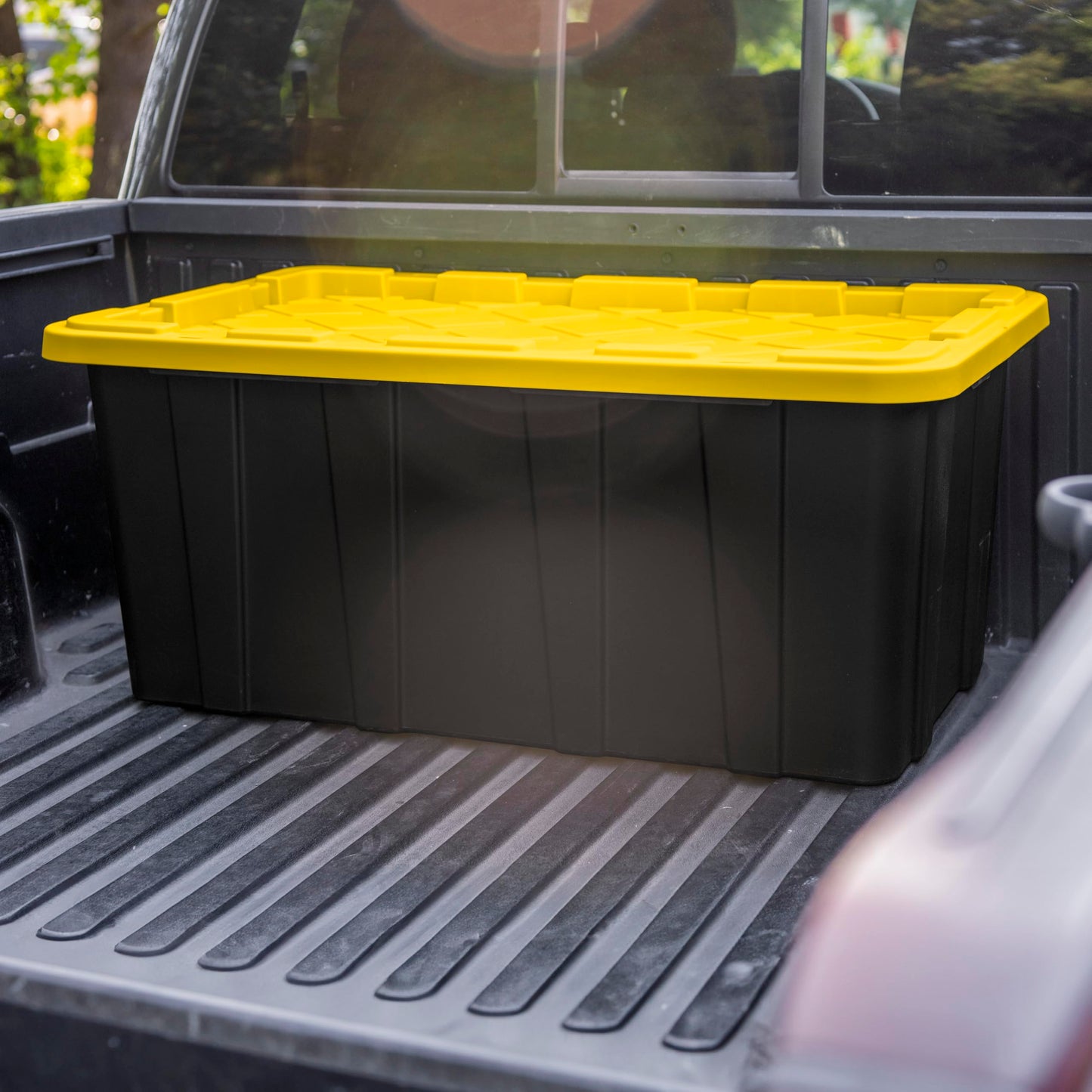 Sterilite 38 Gal Industrial Tote, Stackable Storage Bin with Snap-Fit Lid for Garage, Basement & Attic Storage, Black Base and Yellow Lily Lid, 4-Pack