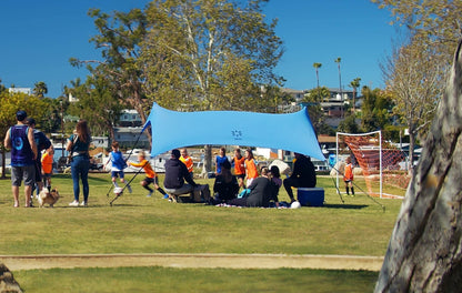 Neso Sidelines Grande Sports Tent - Lightweight and Portable Sun Shelter and Shade Tent for Outdoor Activities - Patented Reinforced Corners - UPF 50+ - 7ft Tall, 11 x 4.5 ft - Periwinkle Blue
