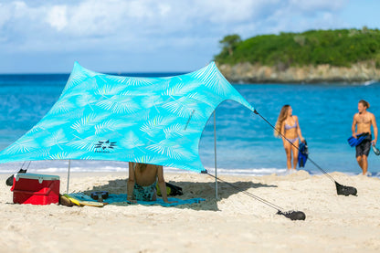 Neso Portable Beach Tent Sun Shelter with Sand Anchor - Lightweight Beach Shade Canopy - Easy Setup for Family Outings - Patented Reinforced Corners - UPF 50+ Sun Protection - 7 x 7ft - Aqua Fronds
