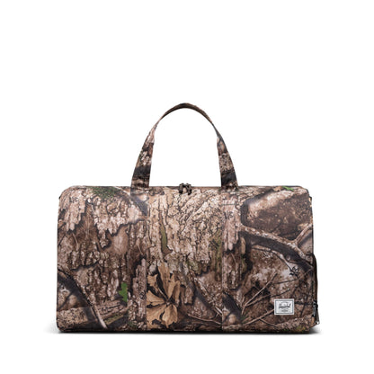 Herschel Supply Co. Unisex Novel Duffle, Realtree APX Camo (Limited Edition), Special Edition - 43L