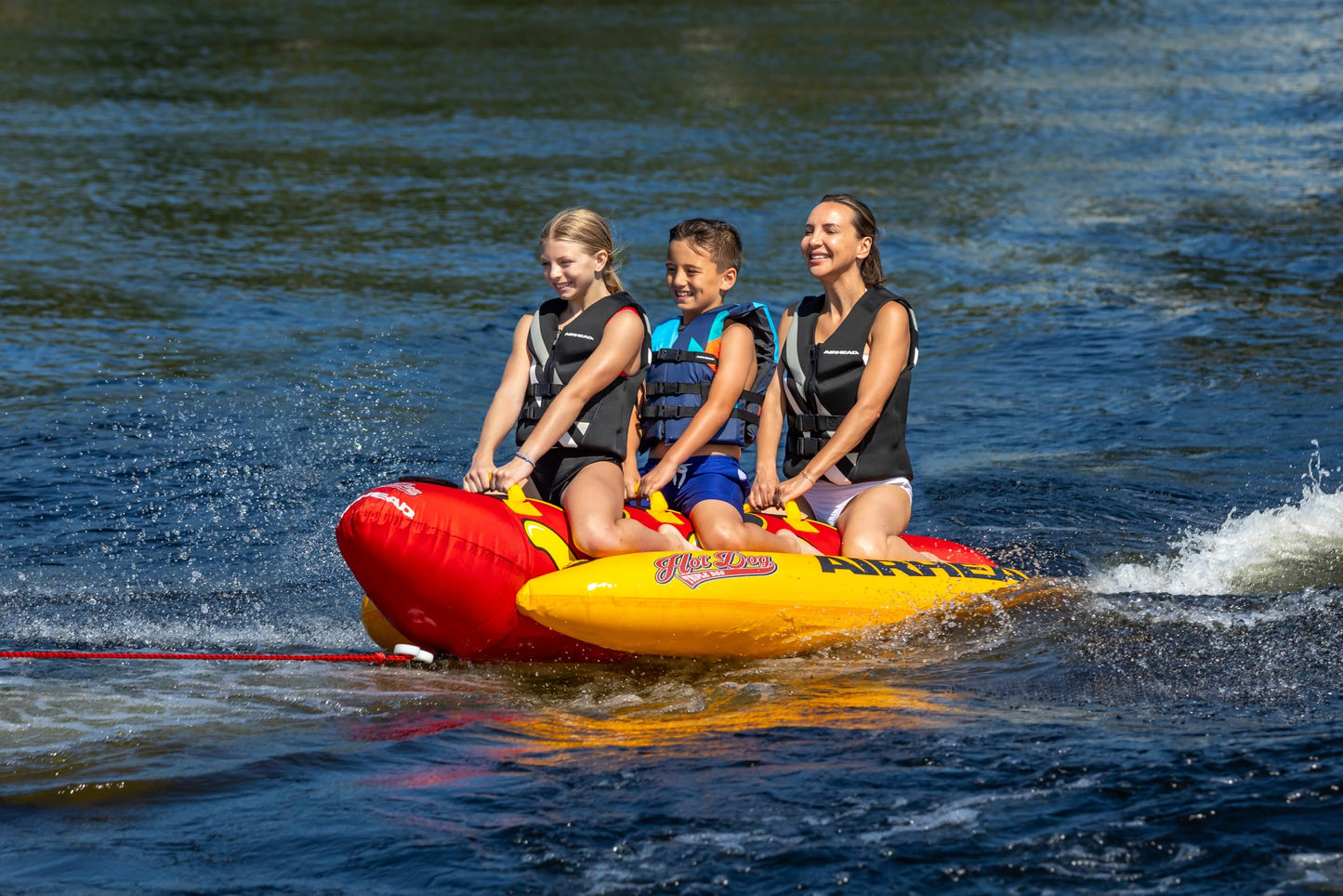 Airhead Hot Dog Towable Tube for Boating, 1 - 3 Rider Inflatable Boat Tube for Water Tubing, Full Nylon Cover, EVA Padding, Foam Padded Handles w/ Neoprene Knuckle Guard, Speed Safety Valve