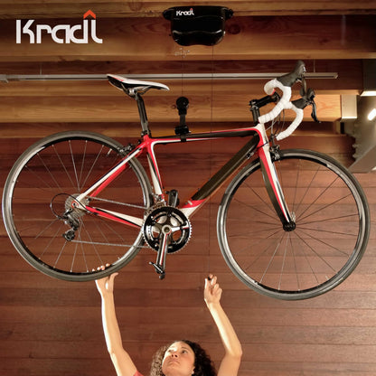 Kradl - Ceiling Mount Bike Lift and Rack. Bicycle Storage Hoist Without Electricity, Clumsy Ropes or Pulleys. 25 Pound Capacity.