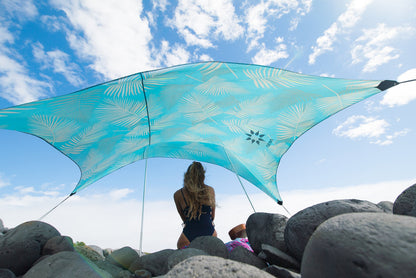 Neso Portable Beach Tent Sun Shelter with Sand Anchor - Lightweight Beach Shade Canopy - Easy Setup for Family Outings - Patented Reinforced Corners - UPF 50+ Sun Protection - 7 x 7ft - Aqua Fronds