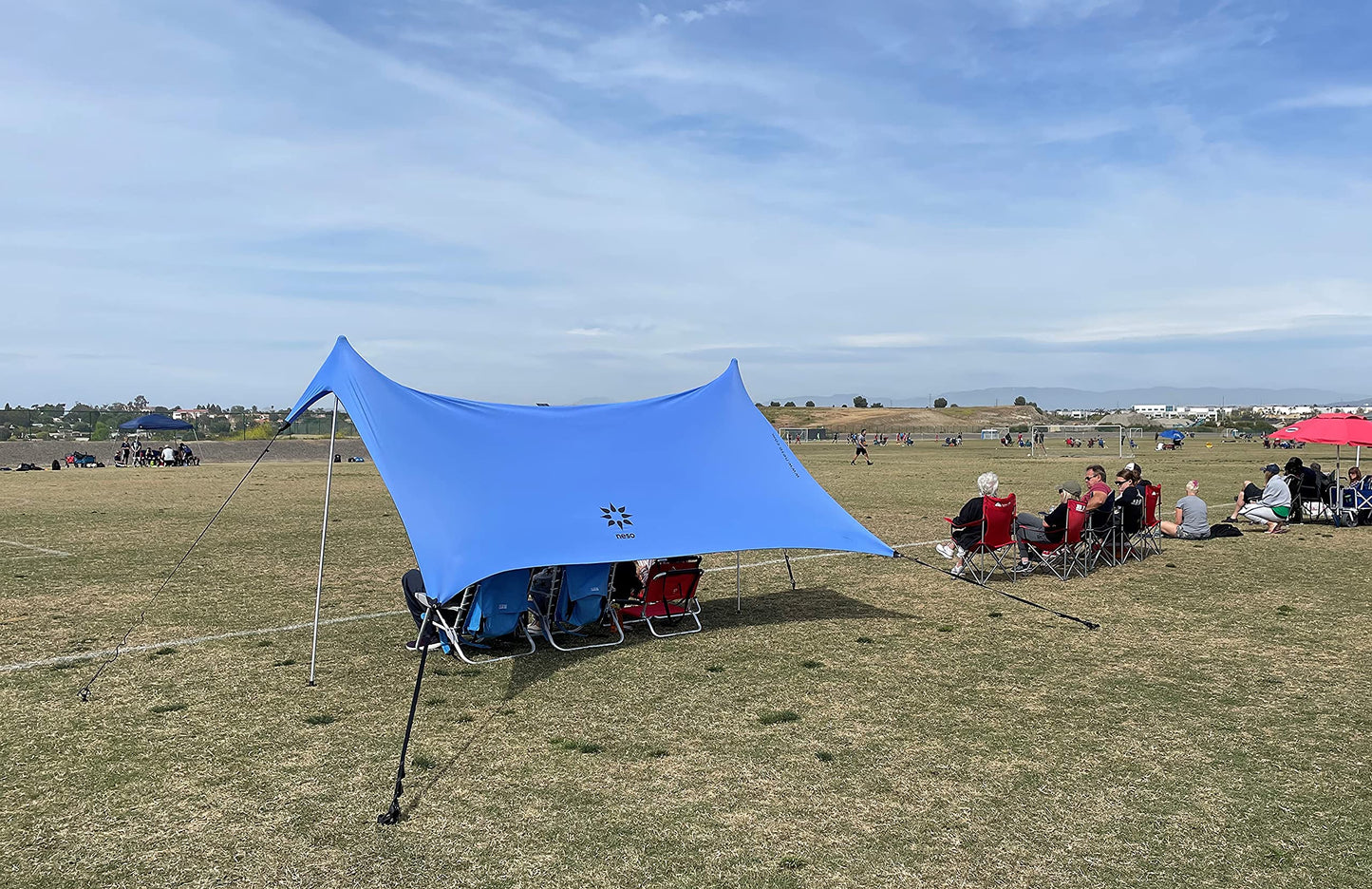 Neso Sidelines Grande Sports Tent - Lightweight and Portable Sun Shelter and Shade Tent for Outdoor Activities - Patented Reinforced Corners - UPF 50+ - 7ft Tall, 11 x 4.5 ft - Periwinkle Blue