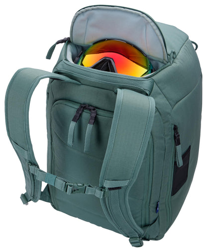 Thule RoundTrip 45L Boot Backpack - Storage compartments to organize and protect gear - Boot bag for ski and snowboard travel - Soft pocket for goggles and helmet - Built in standing pad